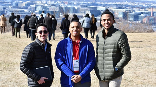 manrrs-collegiate-group-three-people-outside