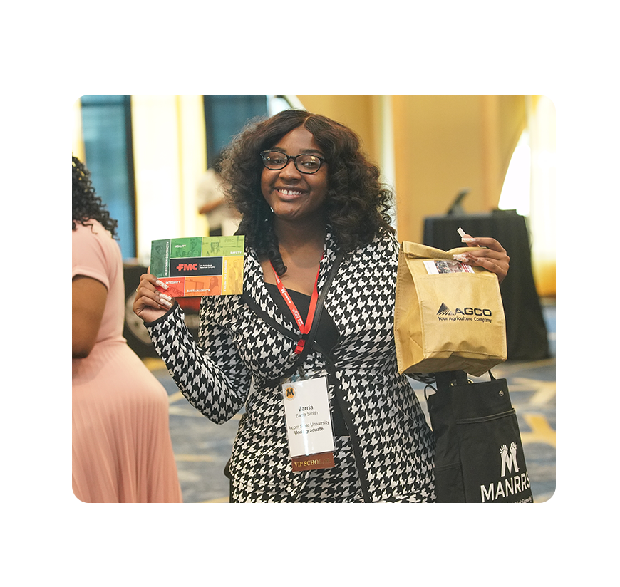 Smiling Conference Attendee with Career Expo Swag