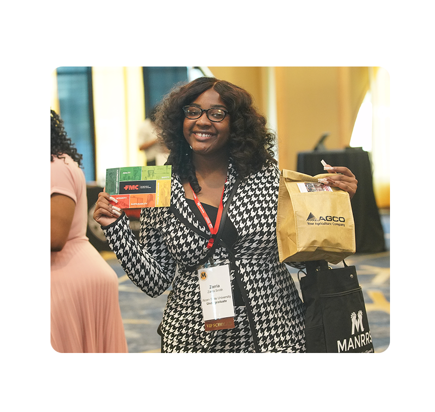 Smiling Conference Attendee with Career Expo Swag